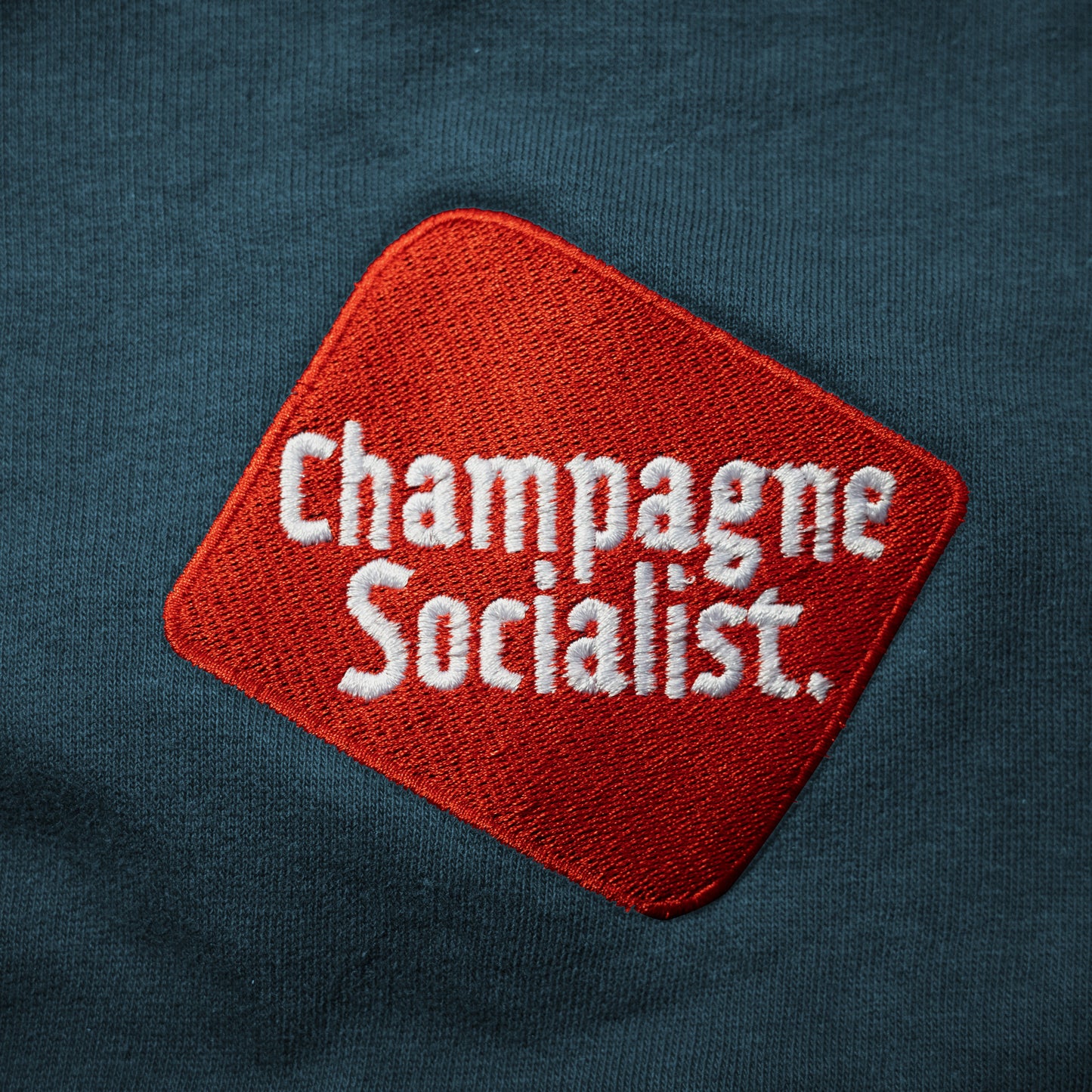 Champagne Socialist Embroidered Sweatshirt (Petrol Blue)
